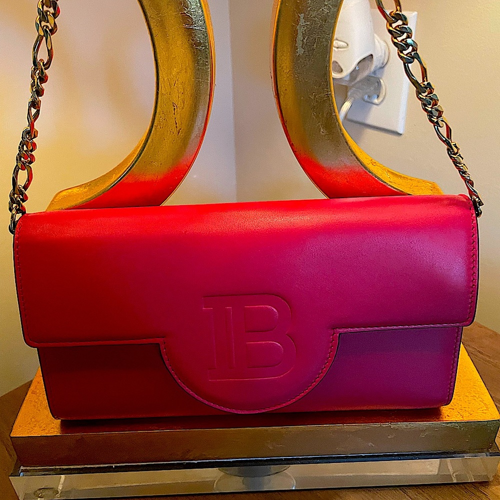 Red Balmain wallet on a chain